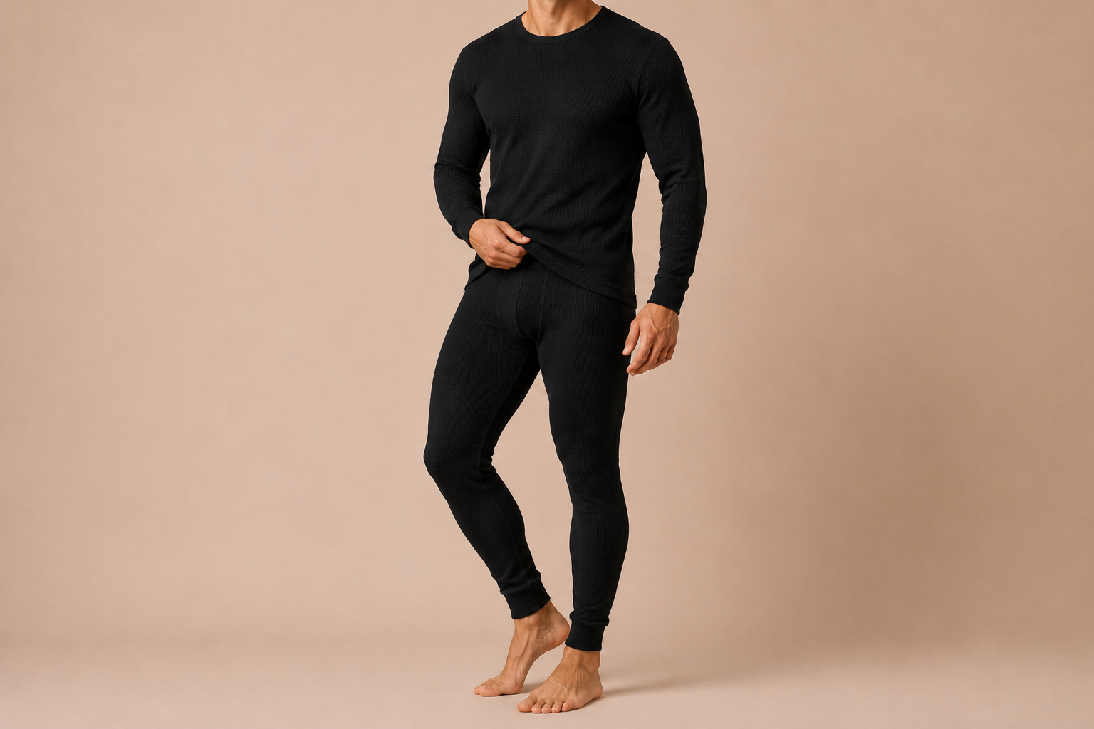 Model wearing Skyland black waffle-knit thermal top and bottom set