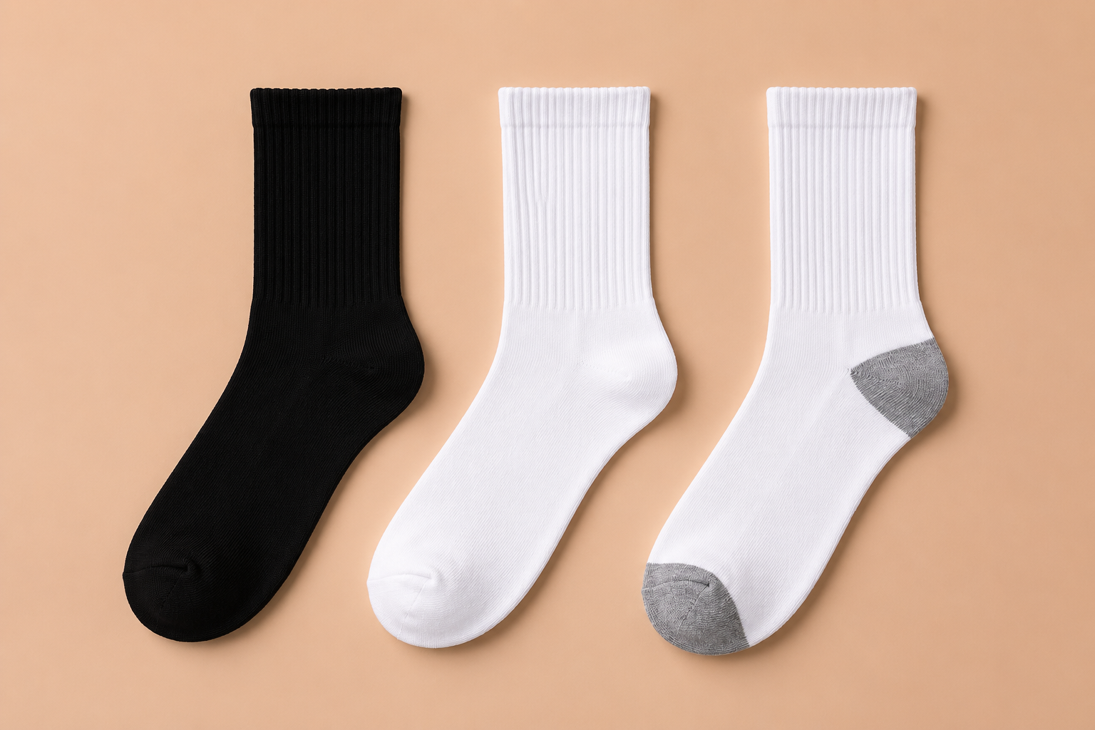 Skyland crew socks in black, white, and white with gray heel and toe laid flat