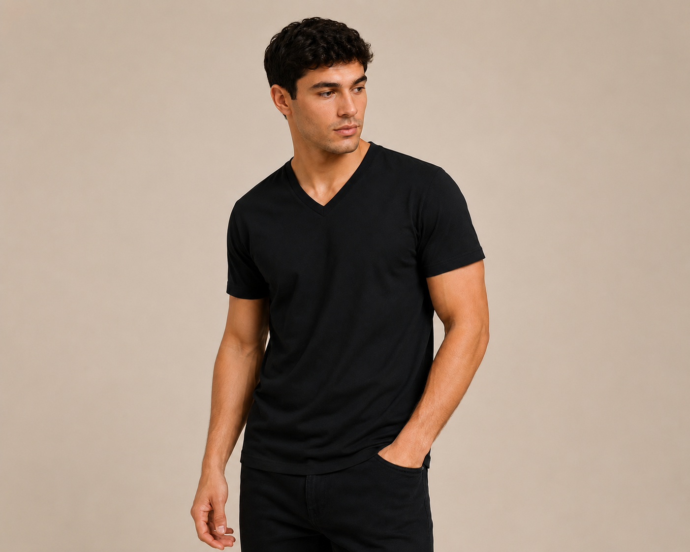 Model wearing a plain black Skyland V-neck t-shirt in a studio setting